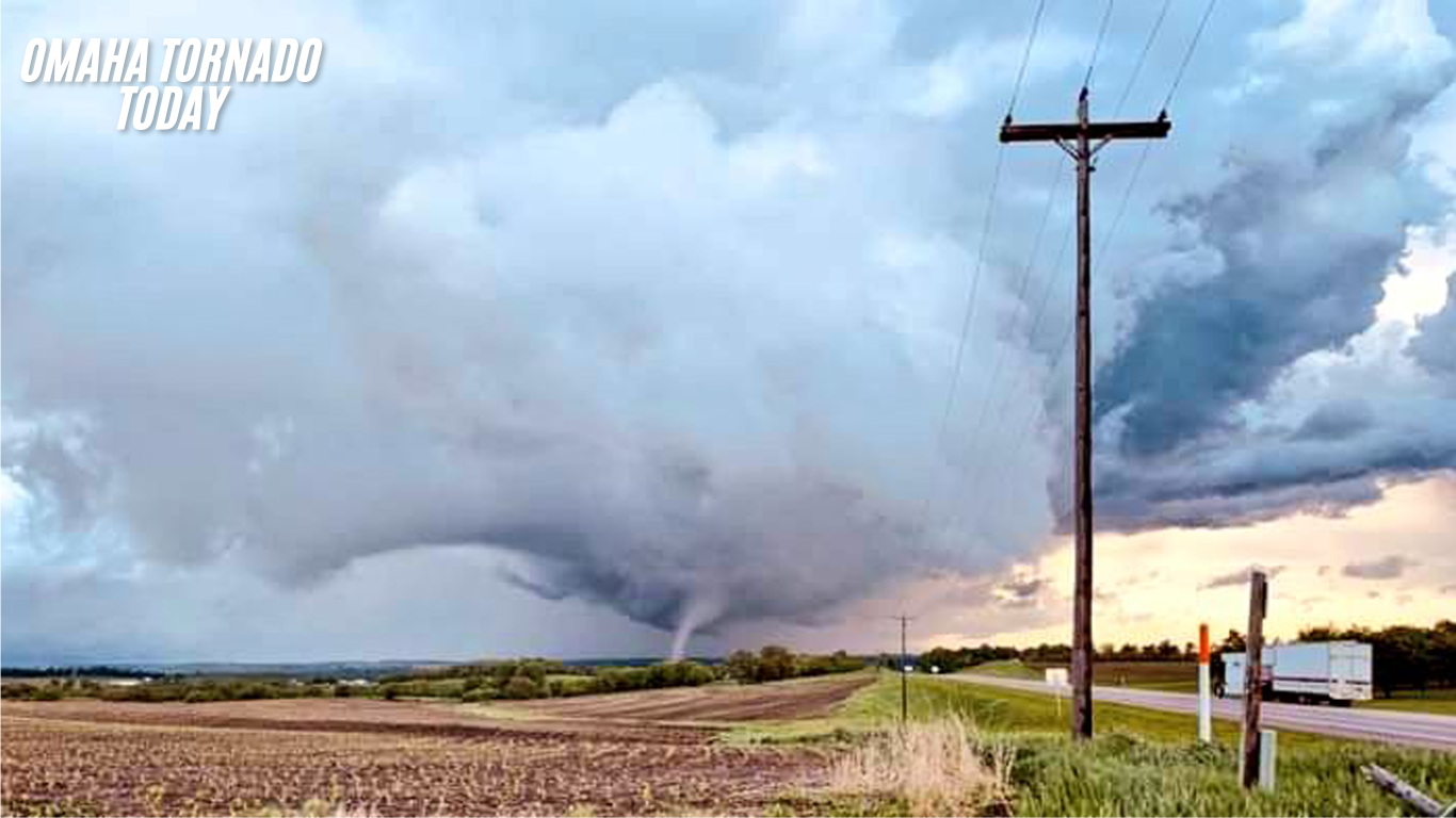 Tornado aftermath in Omaha suburbs with damaged homes and uprooted trees.