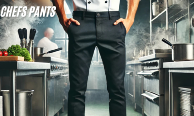 A professional chef wearing durable and stylish chefs pants in a bustling kitchen